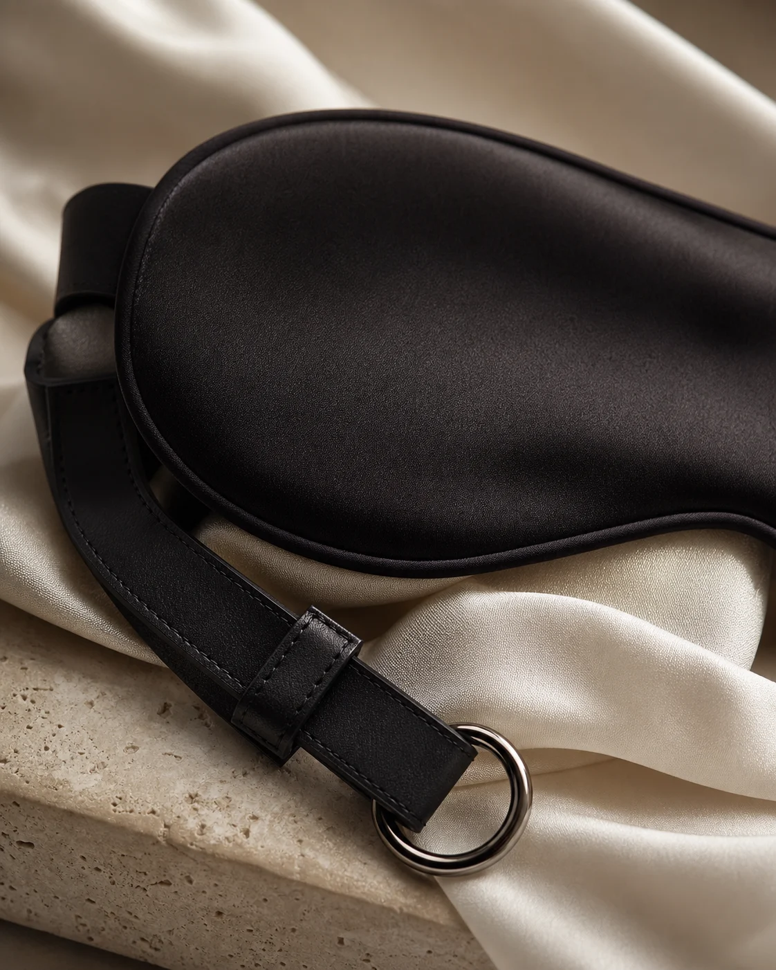 Black silk eye mask on ivory silk